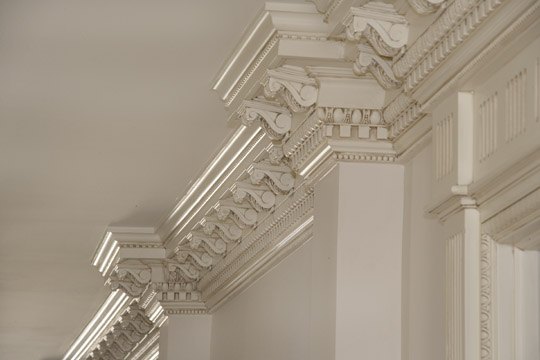 Carved cornice and crown moulding detail in an Alliotts interior